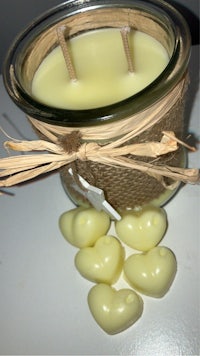 a jar with a bunch of heart shaped candles in it